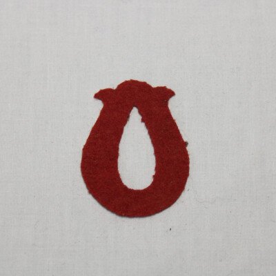 Insigne bourrelier rouge