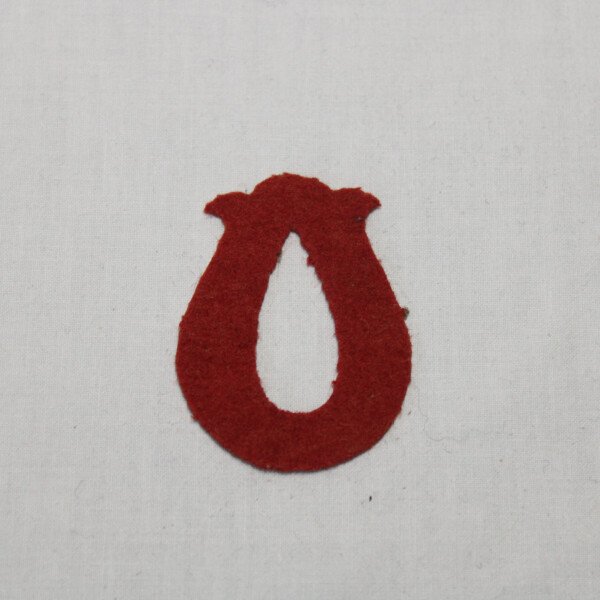 Insigne bourrelier rouge